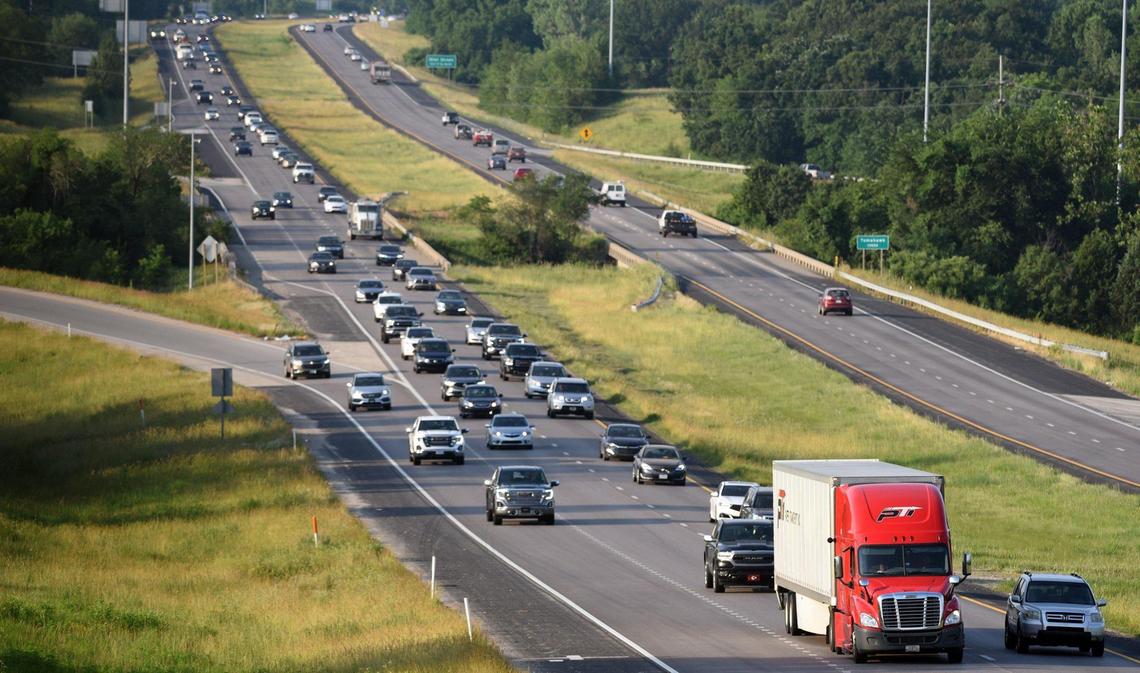 Morning rush hour traffic heads north on U.S. 69, near 132nd Street in Overland Park. Business leaders and state officials have urged the city to agree to add express toll lanes to help pay to widen the busy highway.