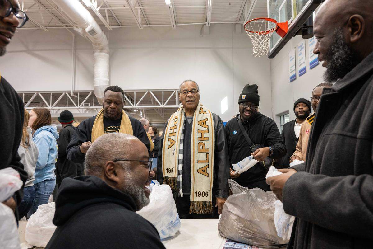 U.S. Rep. Emanuel Cleaver talks with members of Alpha Phi Alpha at Cleaver Family YMCA in Kansas City on Monday, January 19, 2026. Cleaver II was in attendance to celebrate Martin Luther King Jr. Day as hundreds of volunteers created care packages for the less fortunate in Kansas City.