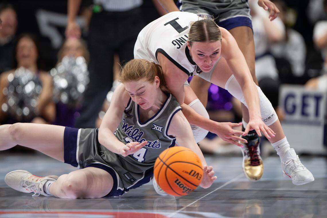 Kansas State Wildcats forward Tess Heal (34) clashes with Oklahoma State Cowgirls guard Amari Whiting (1) for a loose ball during the Big 12 Women’s Basketball Tournament at the T-Mobile Center.