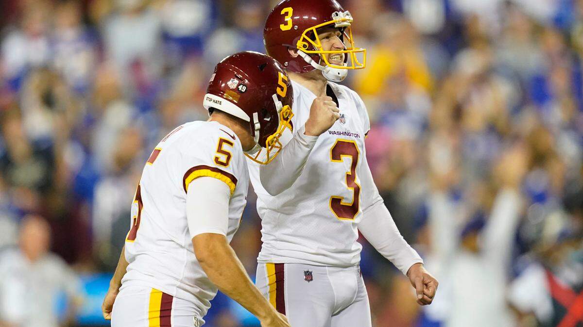 Washington Football Team kicker Dustin Hopkins (3) and punter Tress Way (5) reacting to Hopkins’ making the winning field goal against the New York Giants during the second half of an NFL football game, Thursday, Sept. 16, 2021, in Landover, Md. Washington won 30 - 29. (AP Photo/Patrick Semansky)