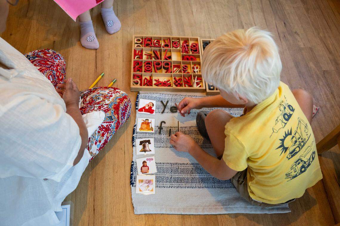 Young children play and learn at a Montessori school ran by Buddhika Kimmanthudawa on Thursday, October 16, 2025, in Leawood. Kimmanthudawa is facing legal threats from her HOA because of parking, traffic complaints and HOA is claiming that she can't operate a business in the HOA.