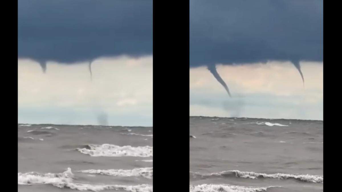 A formation of six waterspouts formed over Lake Erie, video shows.