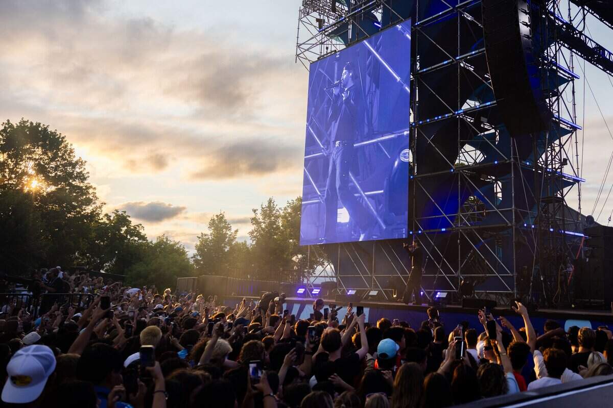 The crowd holds their arms out during the FIFA Fan Fest Chainsmokers concert at Fan Fest on Sunday, June 21, 2026.