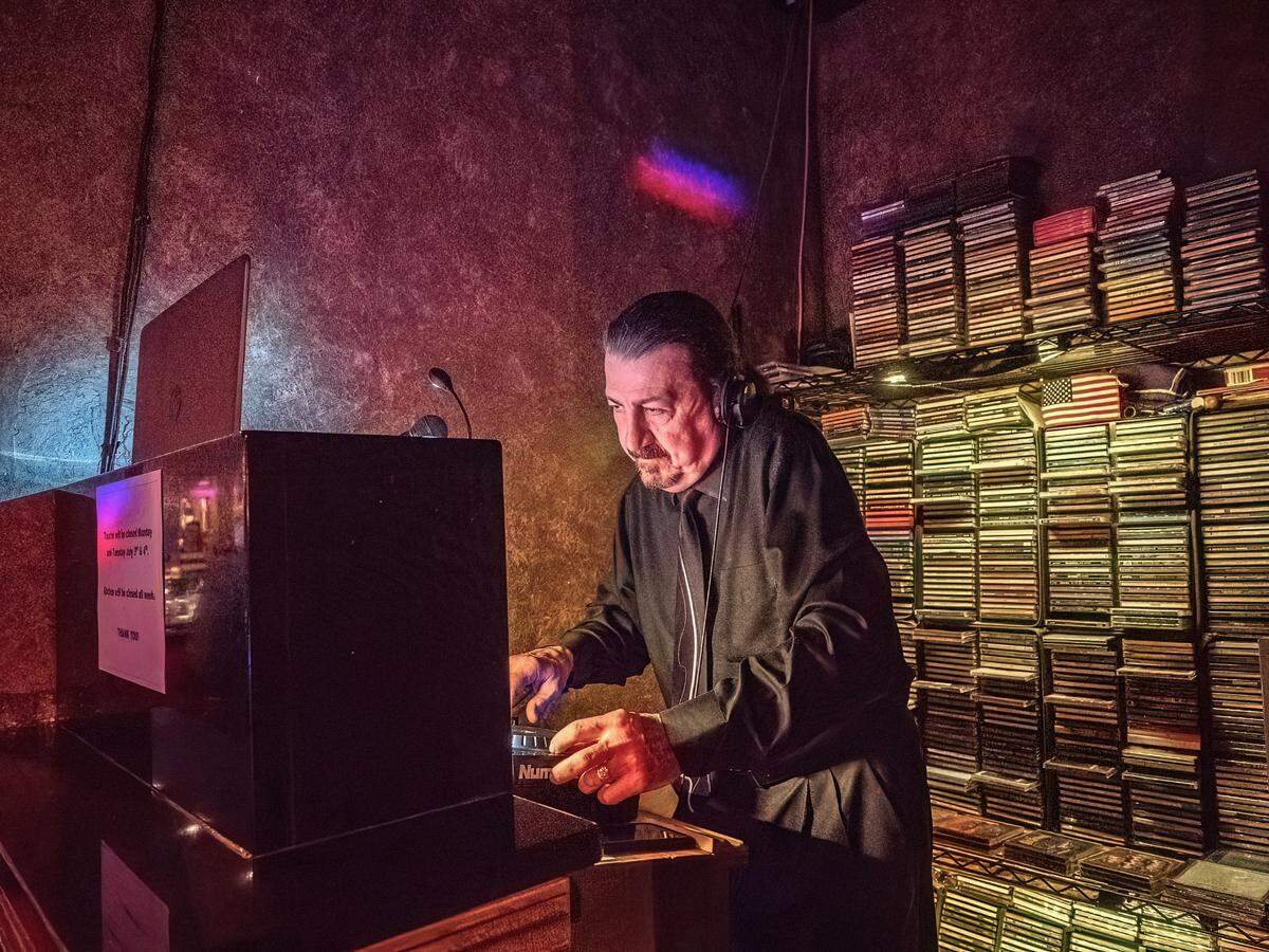 DJ Kent Freeman creates his mix at the Touche nightclub.