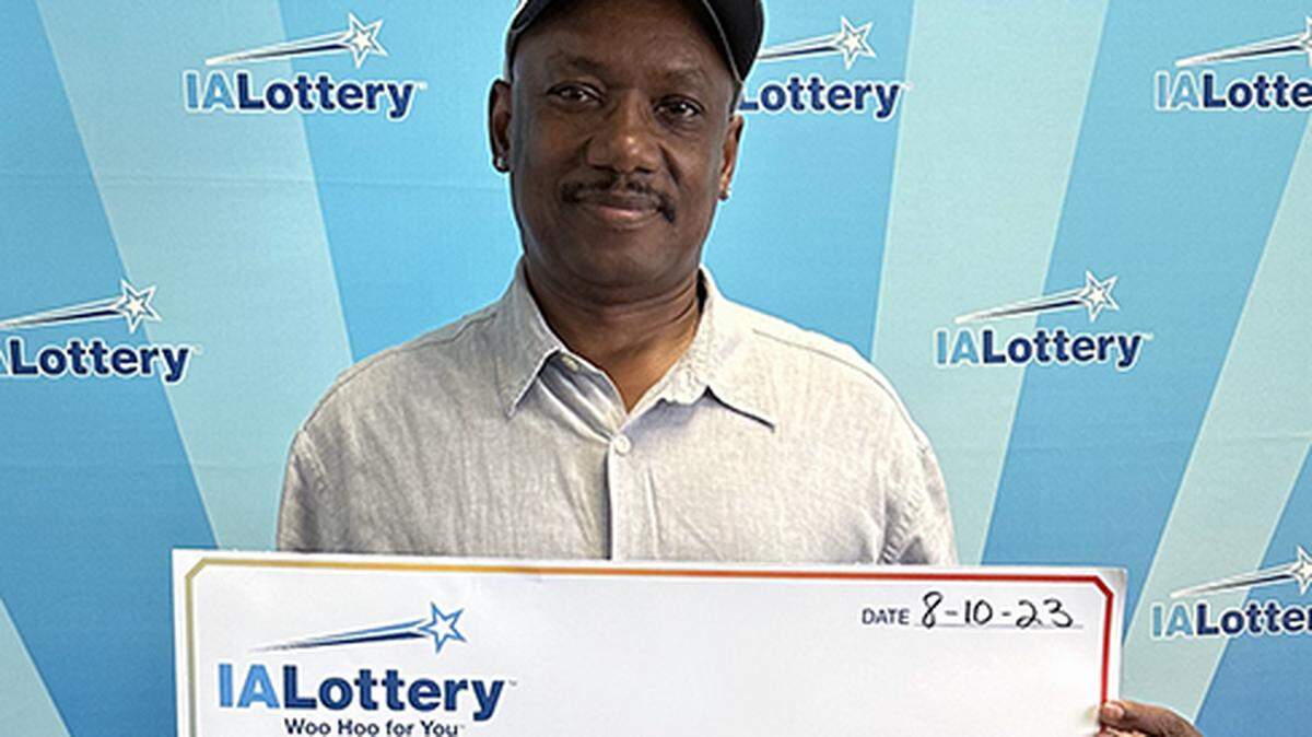 James Holston, 61, with his oversized check.
