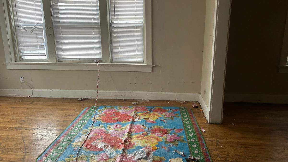 A vacant unit that has been overtaken by squatters.