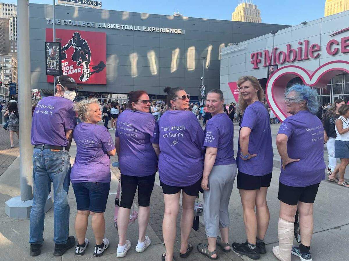 Barry Manilow fans, from left, Stephen Mark, Patty Ganaden, Christine McCurdy, Kara George, Jahanna Griffin, Susan Harp and Corinne Knapp wait outside the pop singer’s concert on Sunday, Aug. 25, at T-Mobile Center in Kansas City.