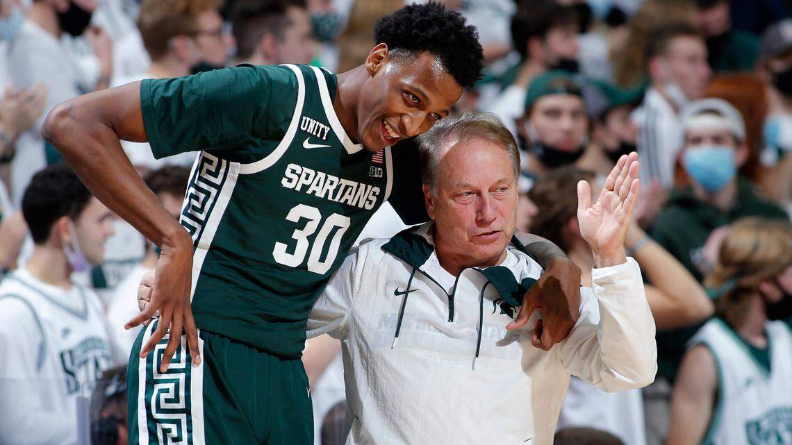 Michigan State coach Tom Izzo, right, talks with Marcus Bingham Jr. during an NCAA college basketball exhibition game against Grand Valley State, Thursday, Nov. 4, 2021, in East Lansing, Mich. Michigan State won 83-60. (AP Photo/Al Goldis)