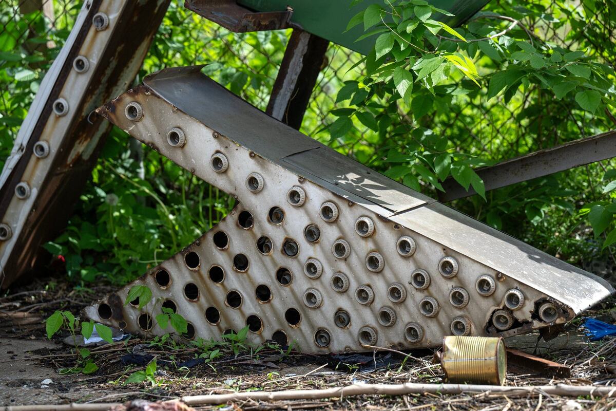 A piece of the Italian Gardens sign sat on the ground near the sign, which was purchased by the Lumi neon museum.