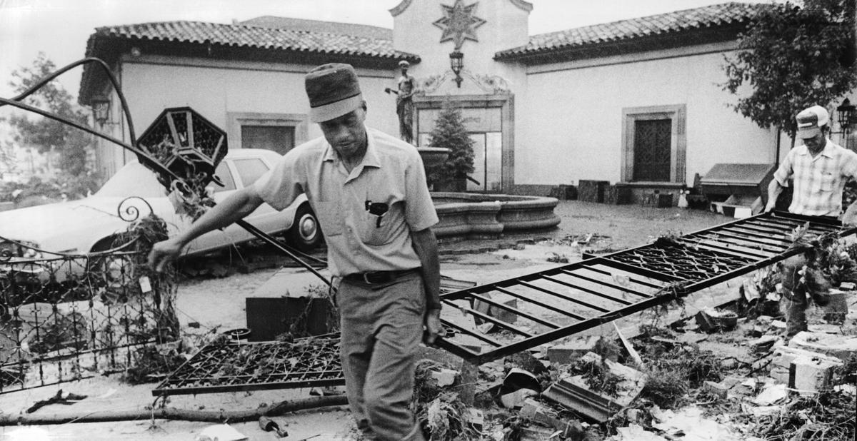 The lead photo on the The Kansas City Star’s front page Sept. 13, 1977, showed a Black man helping to clear debris from Country Club Plaza businesses after a devastating flood struck the night before. While the Plaza remained the prime focus of ensuing coverage, Black victims were mostly ignored in stories and photos.