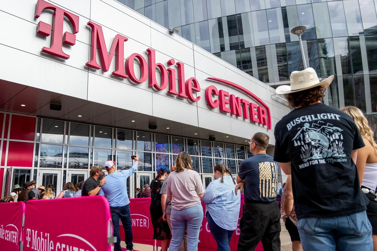 Fans wait outside T-Mobile Center to enter and watch the Dierks Bentley concert on Friday, Aug. 23, 2024, in Kansas City.