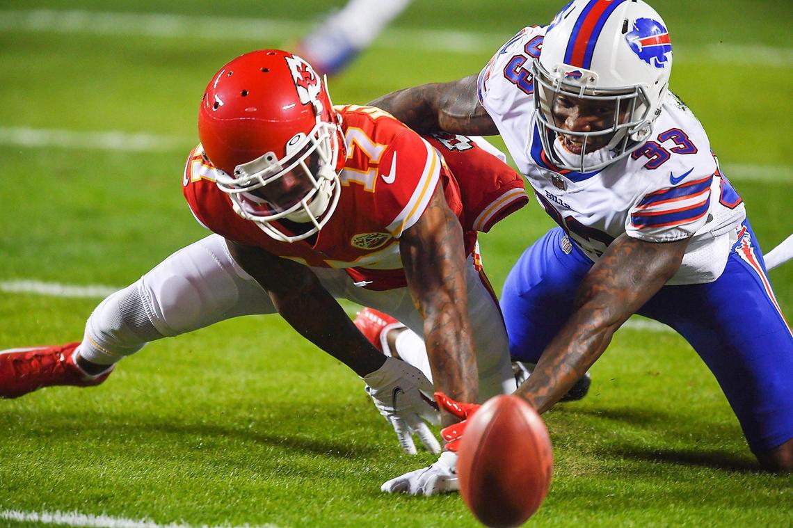 Kansas City Chiefs wide receiver Mecole Hardman battles for the punt reception he fumbled with Buffalo Bills safety Siran Neal in the first quarter Sunday, January 24, 2021, during the AFC Championship Game at Arrowhead Stadium in Kansas City, Missouri. Buffalo recovered the fumble on their 3 yard line and quickly converted the turnover into a touchdown.