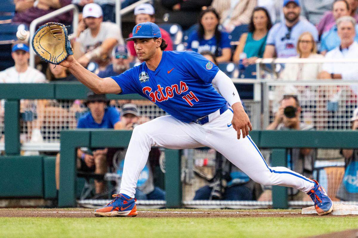 Playing first base for the Florida Gators during a game this past season, Jac Caglianone makes the putout in a game against Texas A&M.