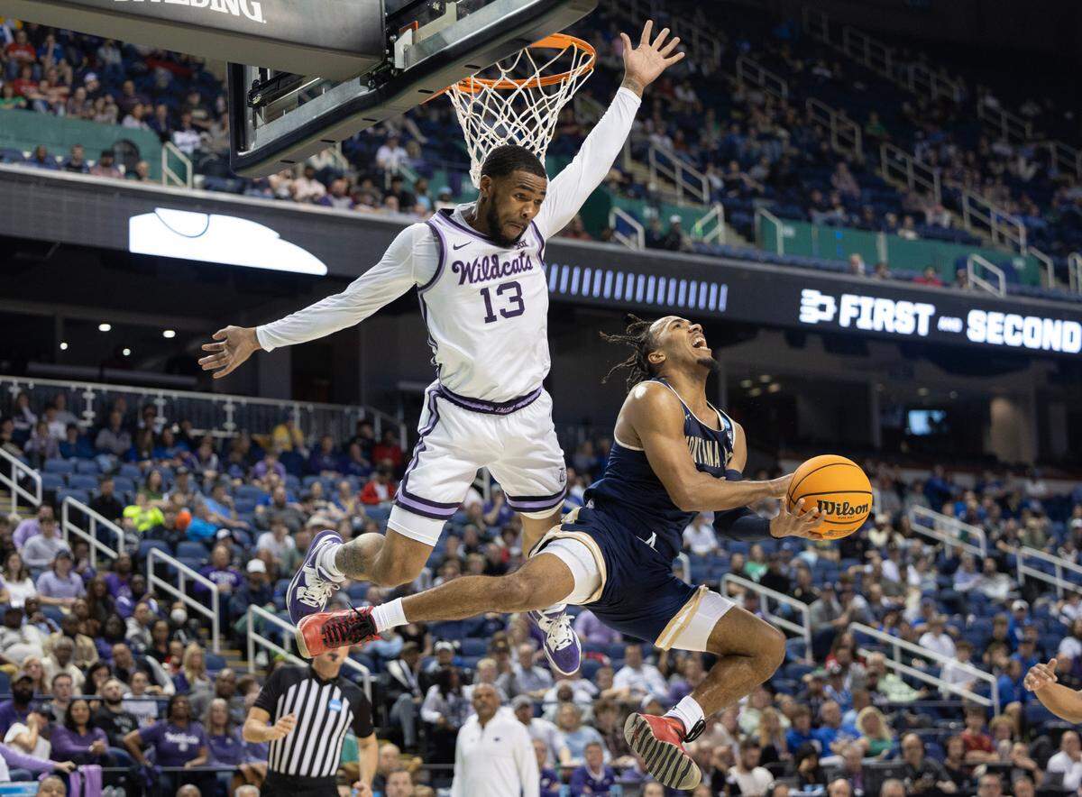 Kansas State’s Desi Sills fouls Montana State’s Robert Ford III during the first half of their first round NCAA Tournament game in Greensboro, NC on Friday night.