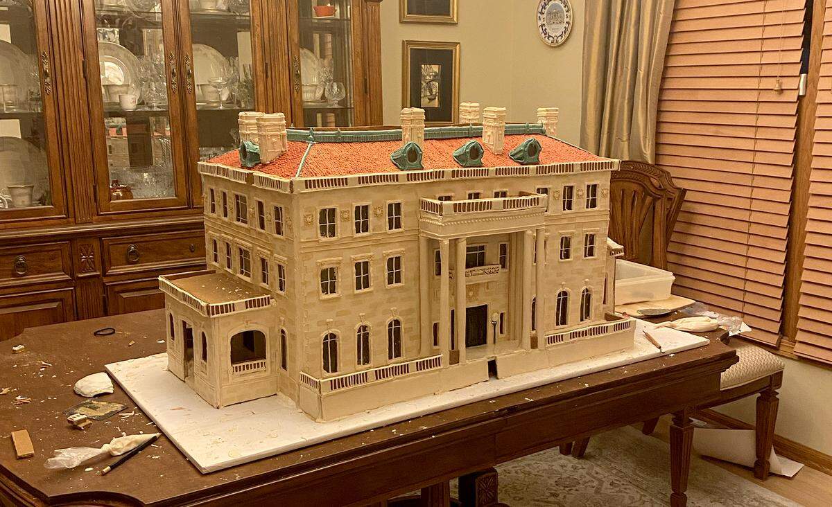 Tobiason builds the houses on her dining room table in Blue Springs. She works alone.
