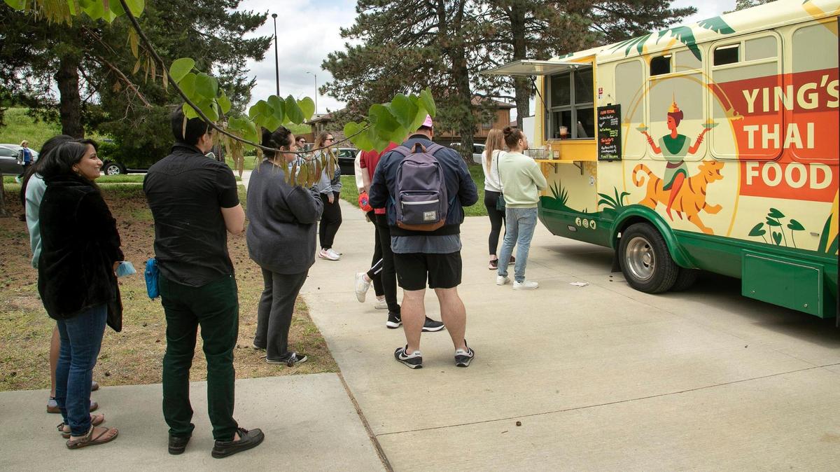 Customers lined up to sample Yin’s Thai food during the Asian American and Pacific Islander Heritage month celebration Saturday, May 21, 2022, at Columbus Park in Kansas City.