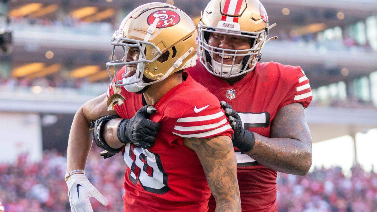 San Francisco 49ers wide receiver Ronnie Bell (10) was congratulated by guard Aaron Banks (65) after scoring a touchdown against the New York Giants during the second quarter at Levi’s Stadium.