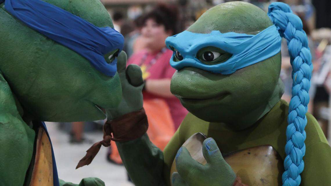A pair of teenage mutant ninja turtles talk at Comic Con Palm Springs, Saturday, August 25, 2018. Comiccon 1