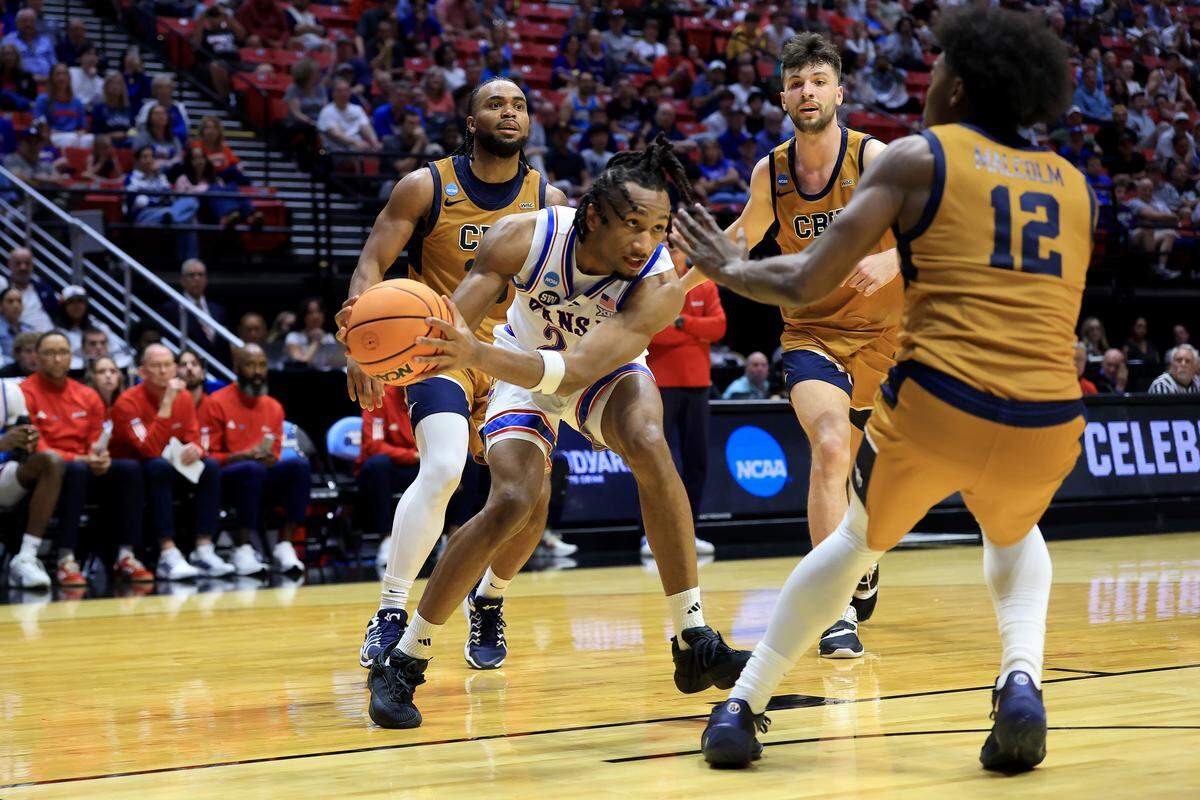 Darryn Peterson #22 of the Kansas Jayhawks drives to the basket against Devon Malcolm #12 of the California Baptist Lancers in the first round of the 2026 NCAA Men's Basketball Tournament at Viejas Arena at San Diego State University on March 20, 2026 in San Diego.