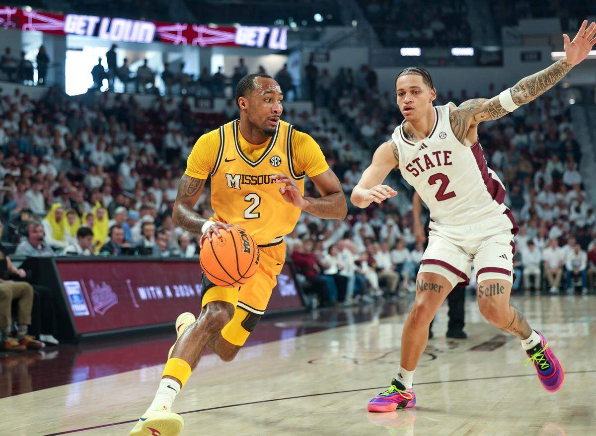Missouri Tigers guard Tamar Bates, left, dribbles around Mississippi State Bulldogs guard Riley Kugel during an SEC basketball game against the Mississippi State Bulldogs at Humphrey Coliseum in Starkville, Mississippi on Saturday, Feb. 1, 2025.