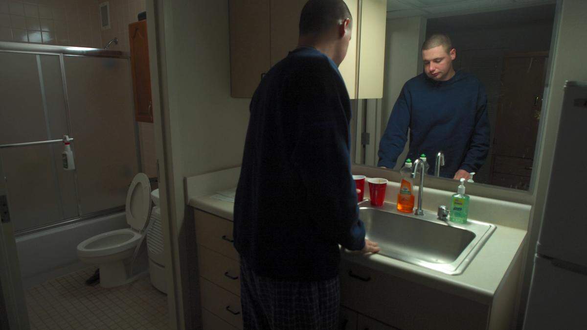 Man cleaning bathroom.