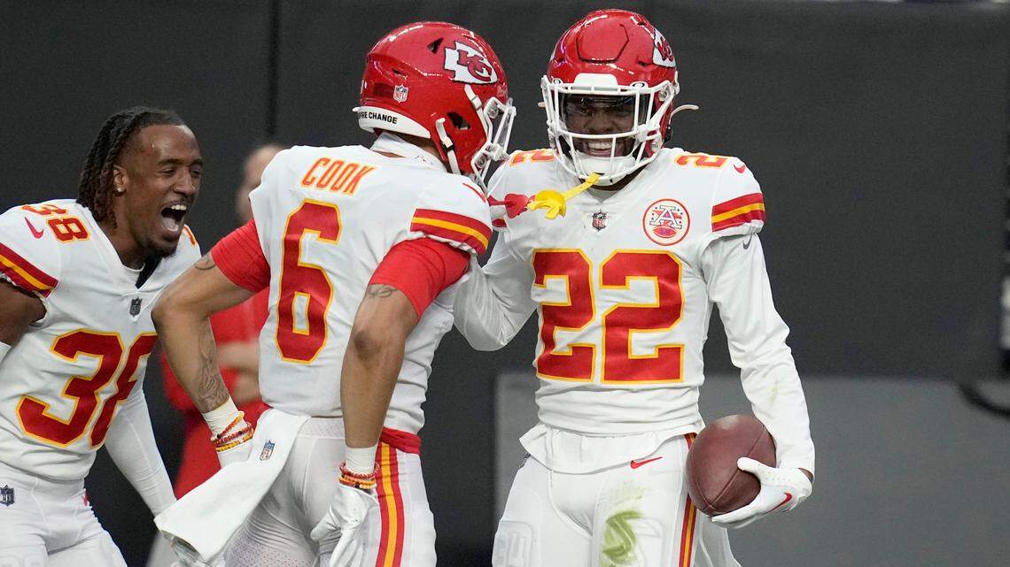 Kansas City Chiefs safety Juan Thornhill (22) is congratulated by Bryan Cook (6) after intercepting a pass during the first half of an NFL football game against the Las Vegas Raiders Saturday, Jan. 7, 2023, in Las Vegas.