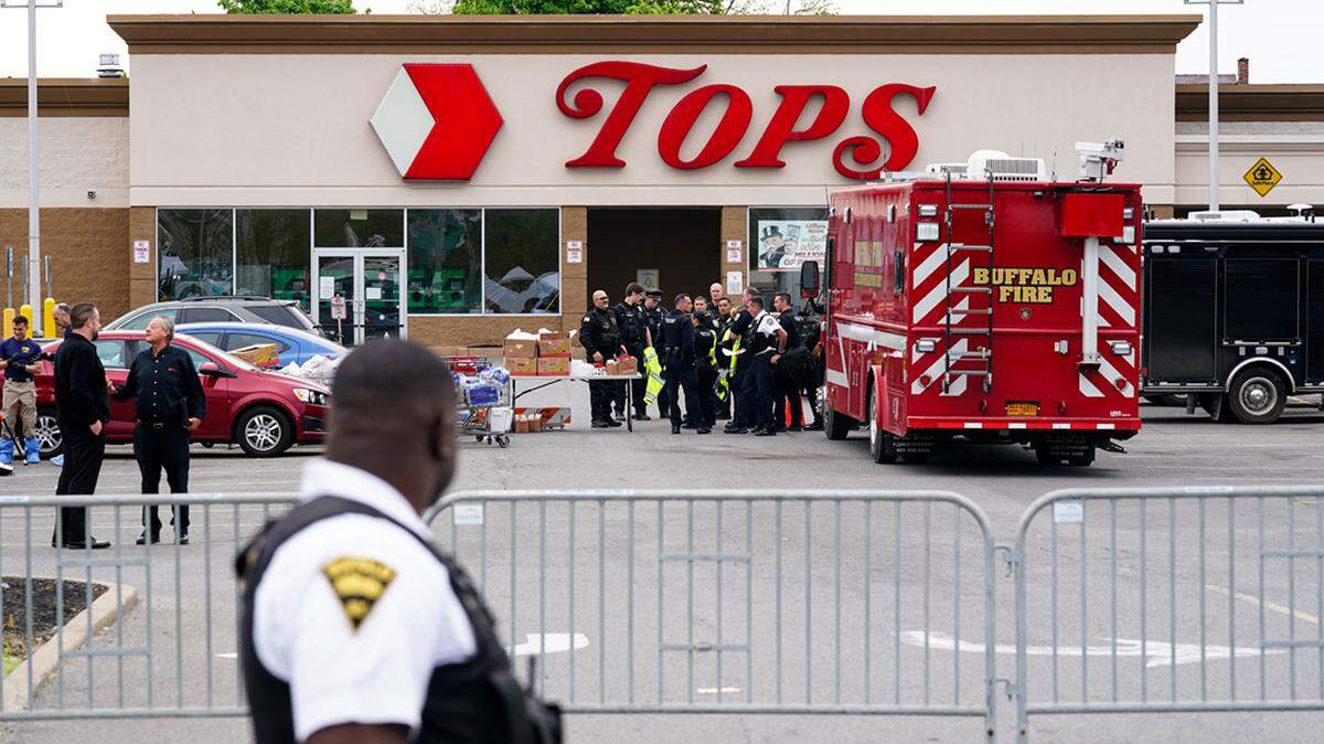 Investigators work the scene of a shooting at a supermarket, in Buffalo, N.Y., Monday, May 16, 2022. While law enforcement officials have grown adept since the Sept. 11 attacks at disrupting well-organized plots, they face a much tougher challenge in intercepting self-radicalized young men who absorb racist screeds on social media and plot violence on their own. (AP Photo/Matt Rourke)