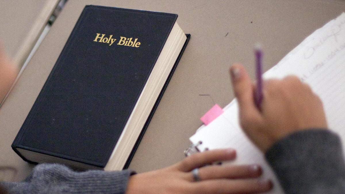 In this 2011 file photo, a bible sits on the desk of a Georgia public high school student.