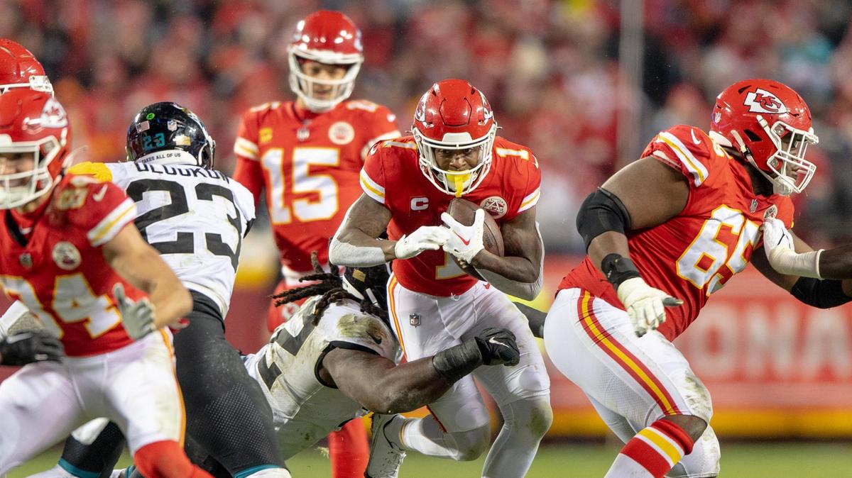 Chiefs running back Jerick McKinnon (at the center of this photo) runs the ball against the Jacksonville Jaguars during last week’s playoff game in Kansas City.