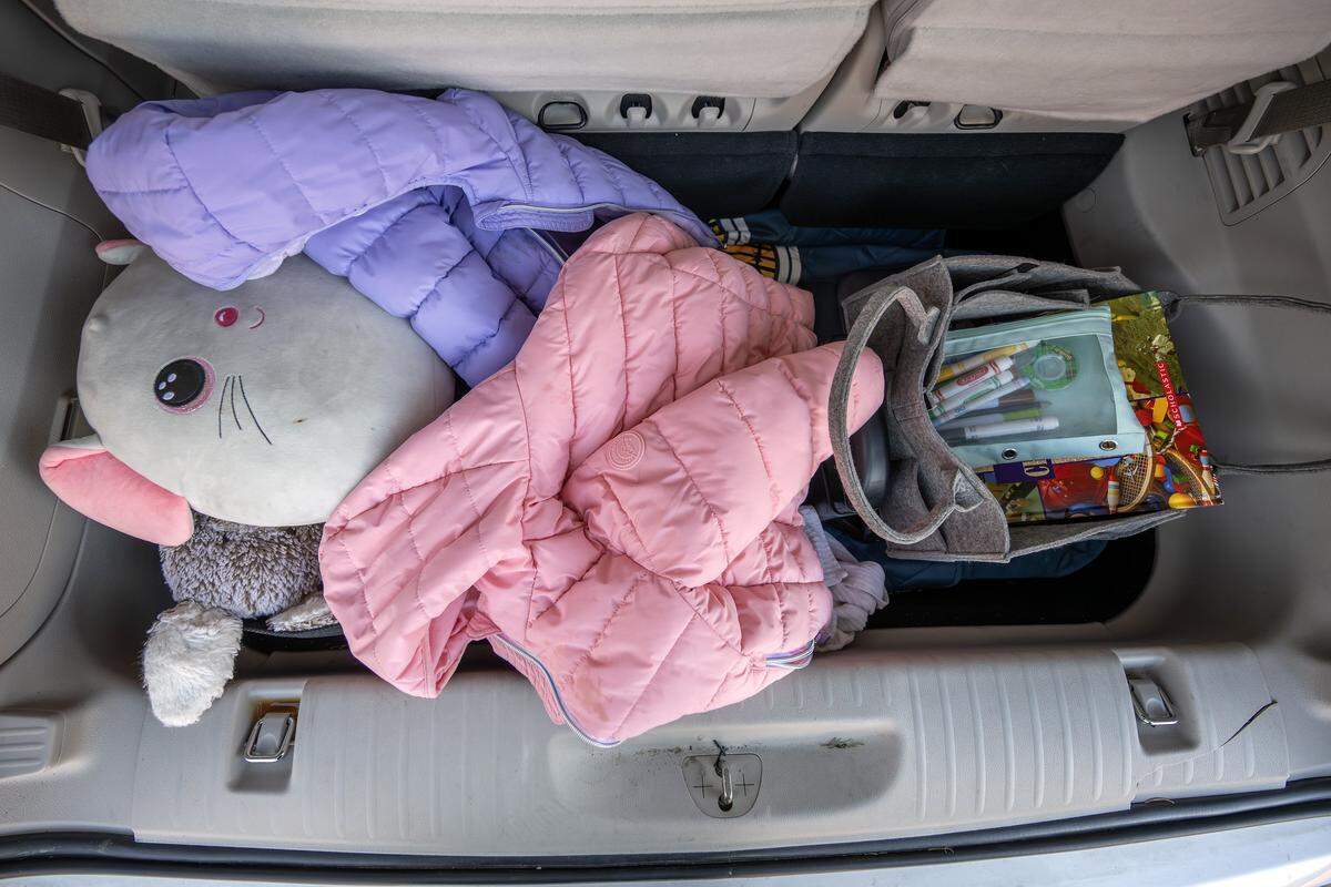 Donated jackets, stuffed animals, books and coloring materials are stored inside the van of Meaghan Fanning, director of youth services and counseling at the Jewish Vocational Office, on Tuesday, Dec. 16, 2025, in Kansas City.