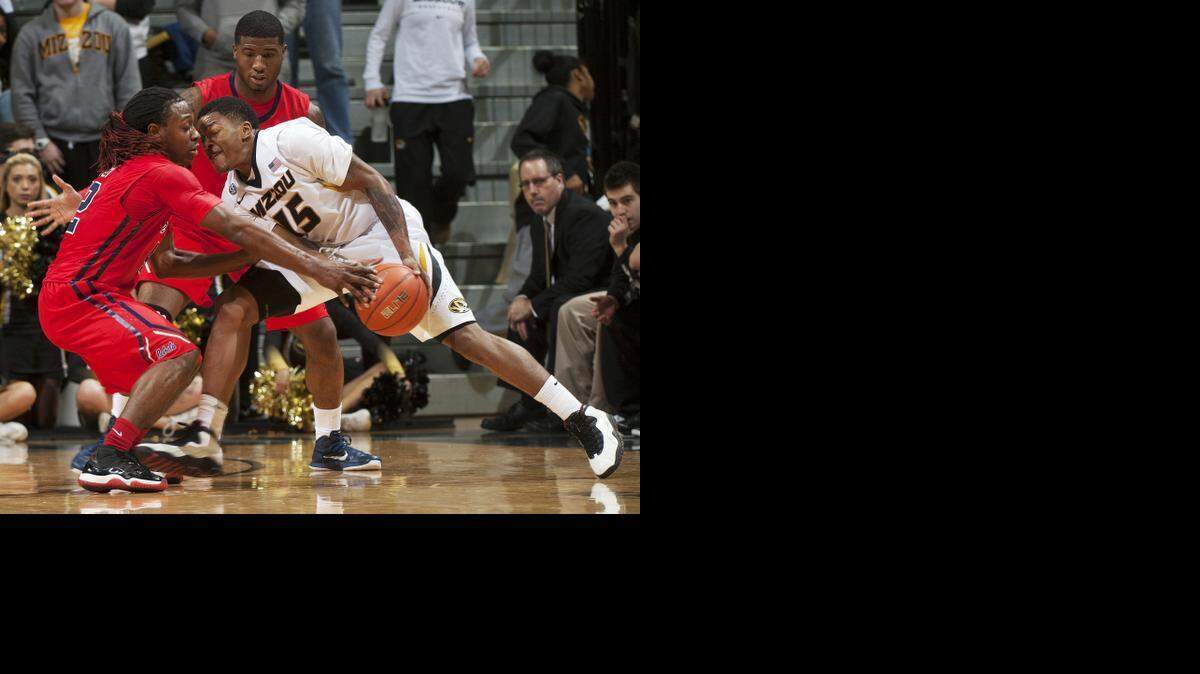 
Missouri's Wes Clark, right, tries to push past Mississippi's Stefan Moody, left, and Martavious Newby during the second half of an NCAA college basketball game Saturday, Jan. 31, 2015, in Columbia, Mo. Mississippi won 67-47. 
