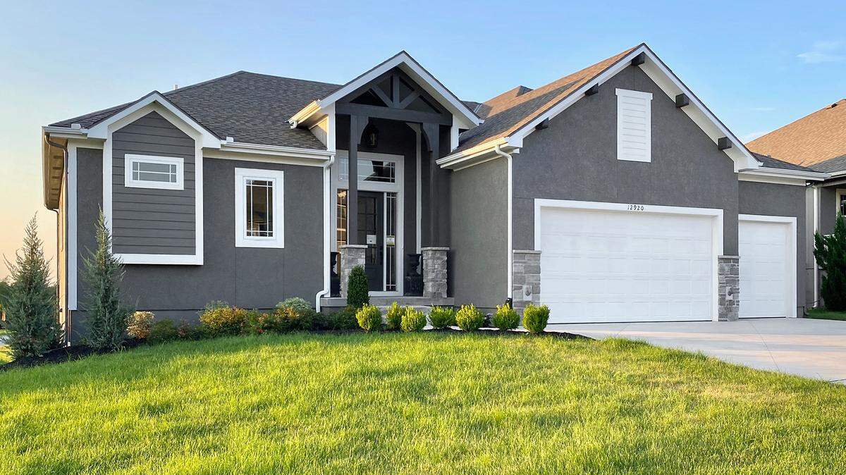 The all-new Madera reverse 1 ½-story model home by Doyle Construction, located at 12920 W. 169th St., features a full-wall Hollywood sliding glass doors to a covered deck, a stunning floor-to-ceiling tile fireplace, private laundry in the owner’s closet with second laundry on lower level, a bonus exercise size room with mirrored wall and a traditional modern motif. Priced at $534,900, which includes a bonus $5,000 Nebraska Furniture Mart gift card, the home is open from noon to 5 p.m. today.