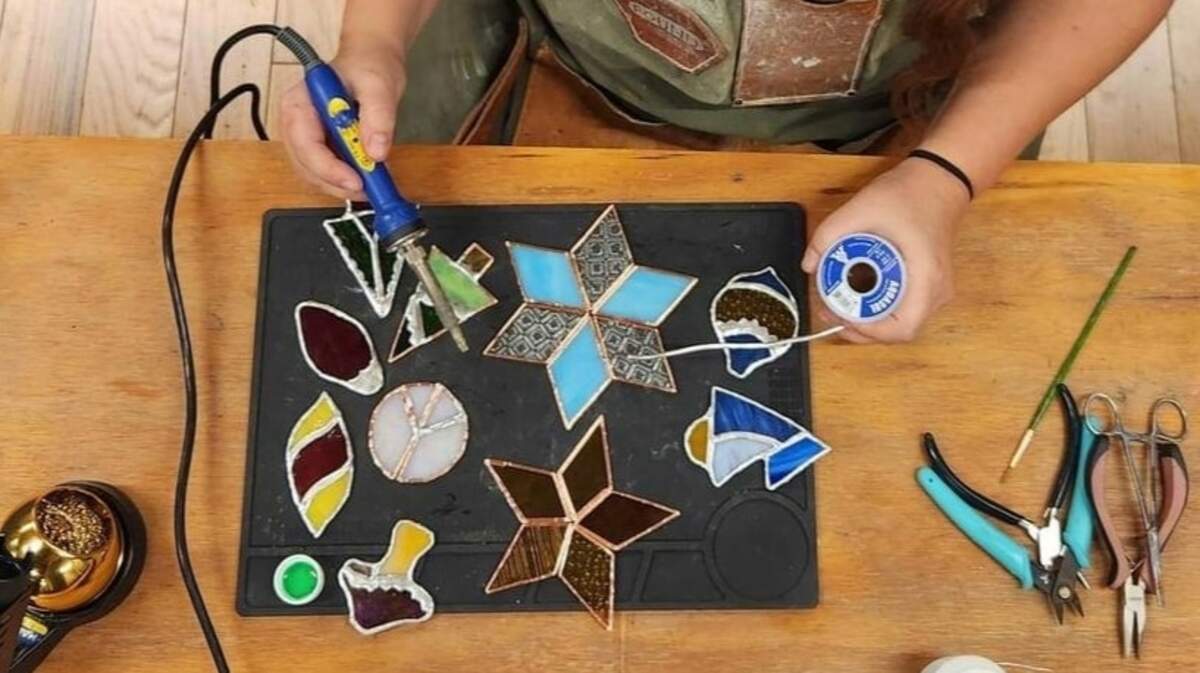 Kansas City based stained glass artist Tara Tonsor makes holiday ornaments for her small business, Lost and Found Design.