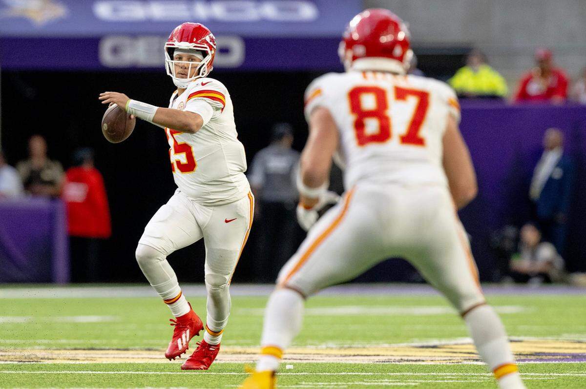 Kansas City Chiefs quarterback Patrick Mahomes (15) winds up to pass the ball to tight end Travis Kelce (87) against the Minnesota Vikings during an NFL football game on Sunday, Oct. 8, 2023, at U.S. Bank Stadium in Minneapolis, Minn.