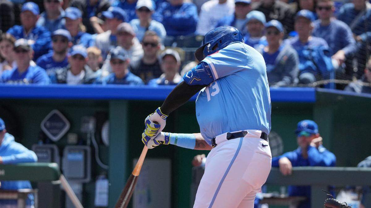 Kansas City Royals designated hitter Salvador Perez (13) hits an RBI single against the Minnesota Twins in the first inning at Kauffman Stadium.