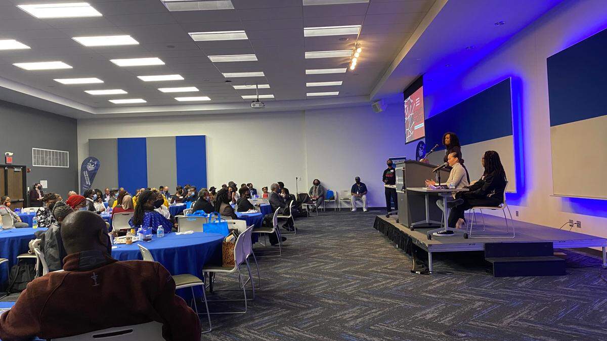 Gwen Grant, president and CEO of the Urban League of Greater Kansas City, presents statistics showing the economic disparities between Black and white people in Kansas City. 