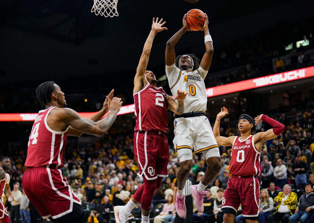 Missouri Tigers guard Anthony Robinson II (No. 0, with ball) rises for a shot against the Oklahoma Sooners during an SEC men’s basketball game Mizzou Arena in Columbia on Wednesday, Feb. 12, 2025.