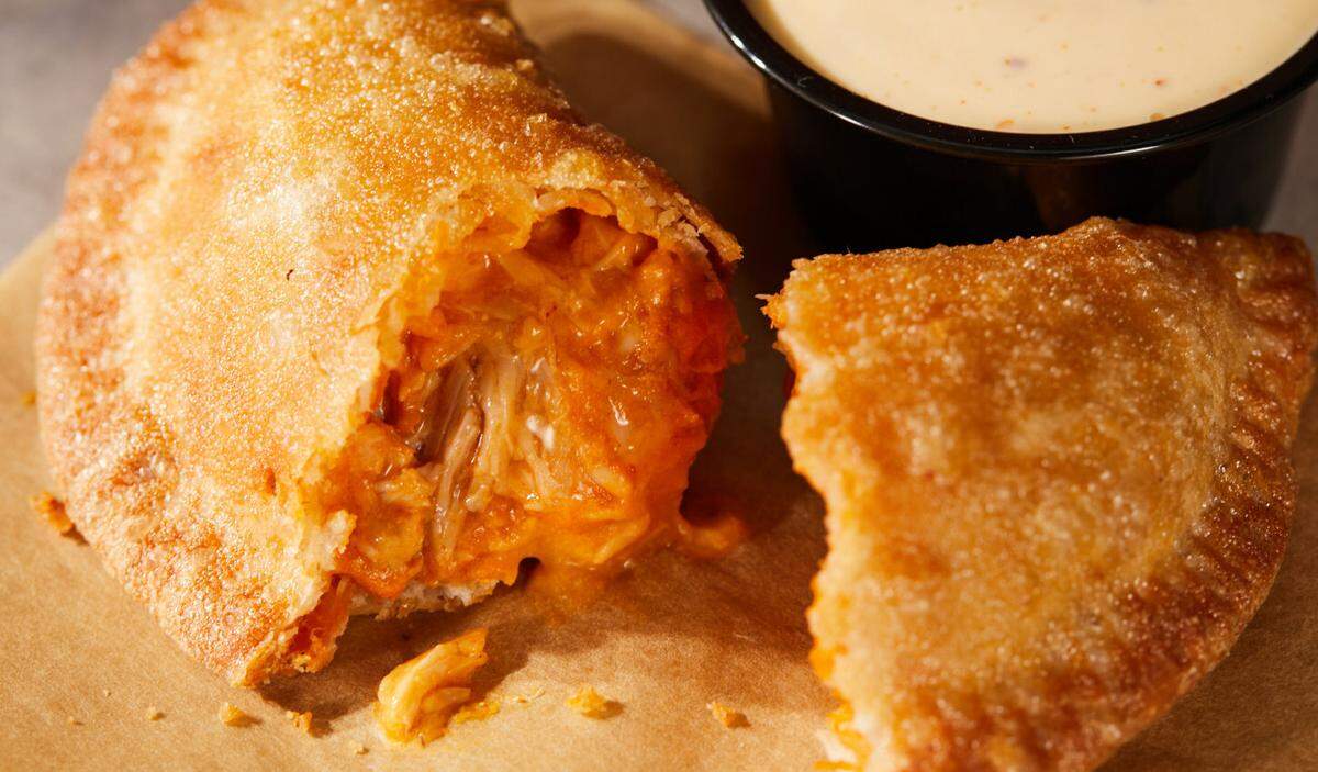The cheesy chicken crispanada is Taco Bell’s take on the iconic empanada and will hit menus nationwide for a limited time starting Thursday, Feb. 15.