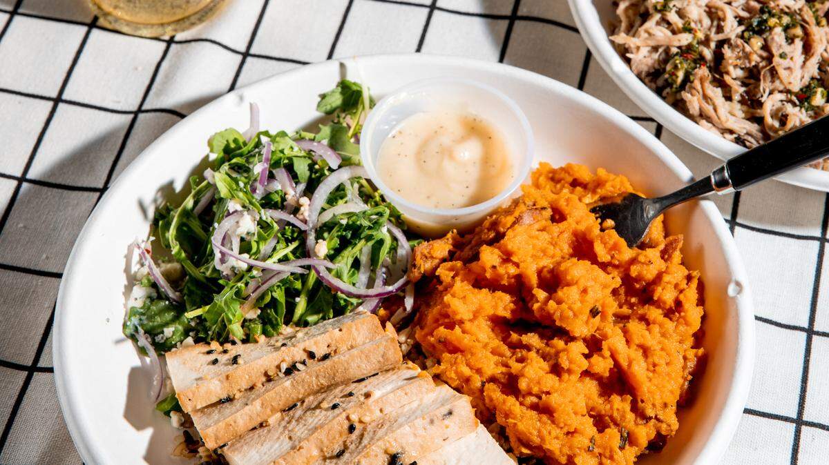 Modern Market Eatery sells salads, pizza, salmon bowls and more.