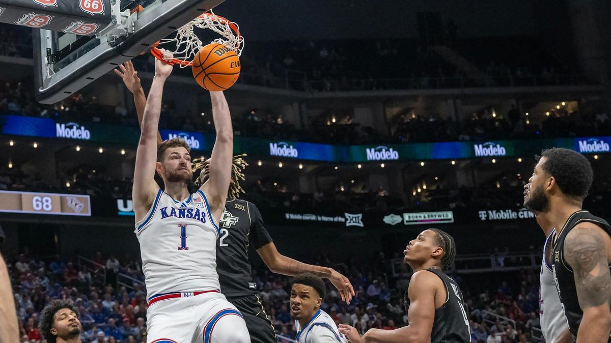 Kansas Jayhawks center Hunter Dickinson (1) slams a dunk in the second half against the UCF Knights at the Big 12 Tournament at T-Mobile Center on Wednesday, March 12, 2025, in Kansas City.