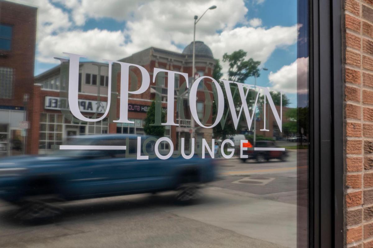 Vehicles drive past Uptown Lounge, which will open in midtown later this month.