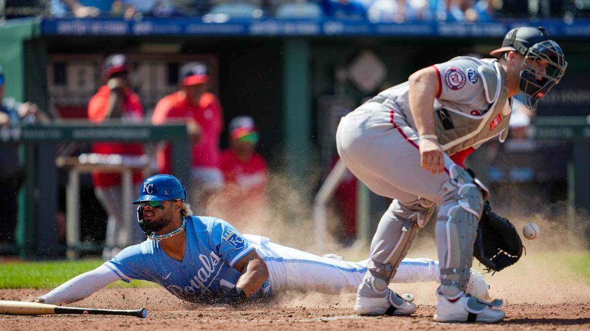Royals right fielder MJ Melendez slides safely into home as the winning run against the Washington Nationals on Sunday at Kauffman Stadium.