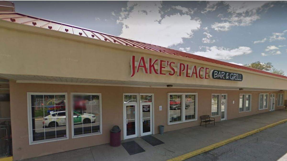 Janine Linnell, the owner of Jake’s Place Bar and Grill, is running a cornhole league in the parking lot in front of the Shawnee restaurant.