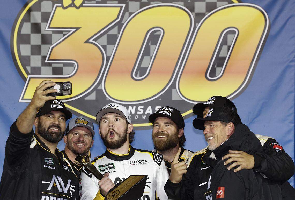 Driver Taylor Gray, third from left, laughs it up in Victory Lane at Kansas Speedway after winning the Kansas Lottery 300 NASCAR O'Reilly Auto Parts Series race on Saturday, April 18, 2026 in Kansas City, Kansas.