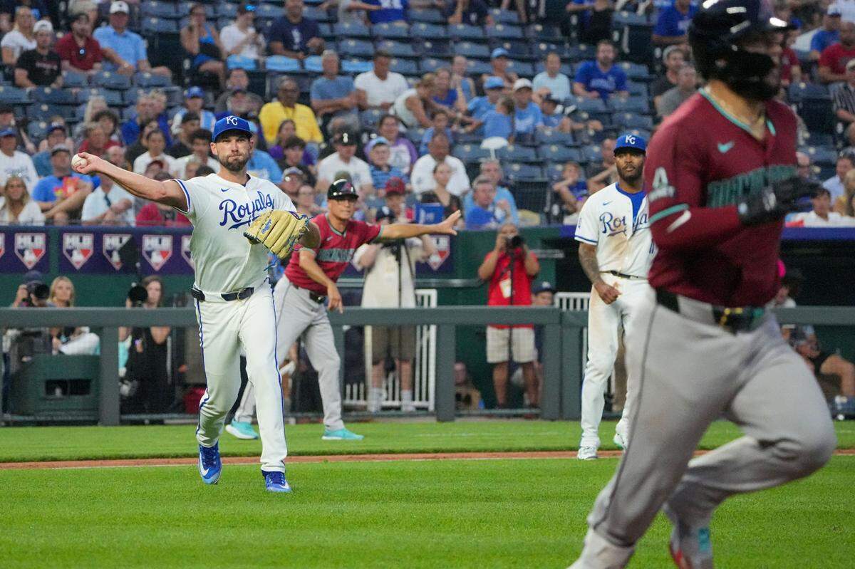 Kansas City Royals pitcher Michael Wacha throws to first for an out against the Arizona Diamondbacks on Wednesday at Kauffman Stadium.