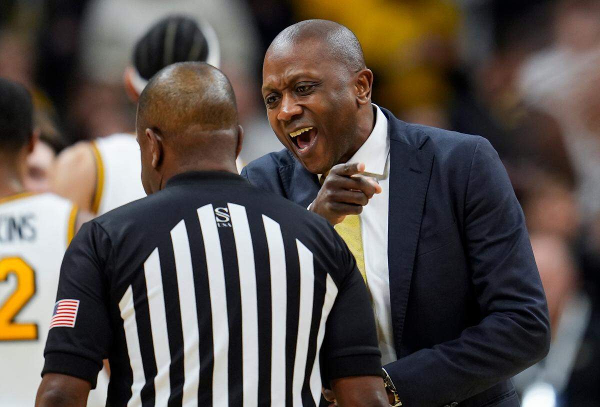 Missouri Tigers men’s basketball coach Dennis Gates talks with referee Pat Adams during an SEC game against the Texas A&M Aggies at Mizzou Arena in Columbia on Saturday, Feb. 8, 2025.
