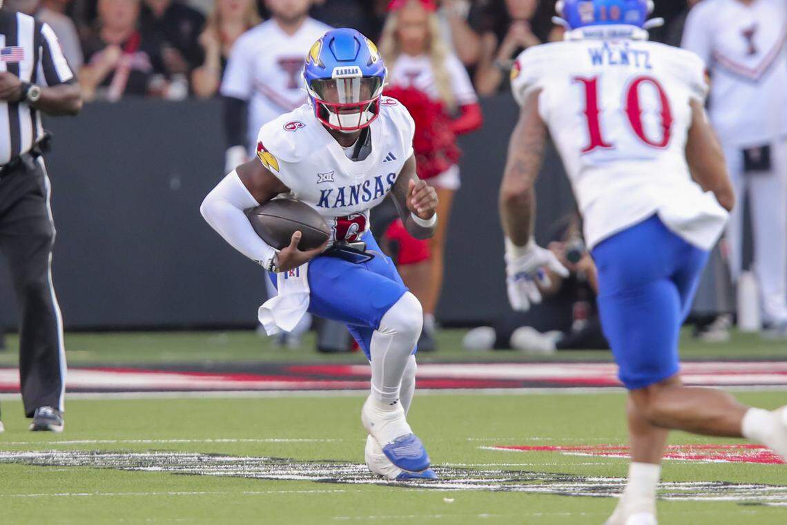 Kansas Jayhawks quarterback Jalon Daniels (6) scrambles against the Texas Tech Red Raiders in the first half at Jones AT&T Stadium on Oct. 11, 2025.
