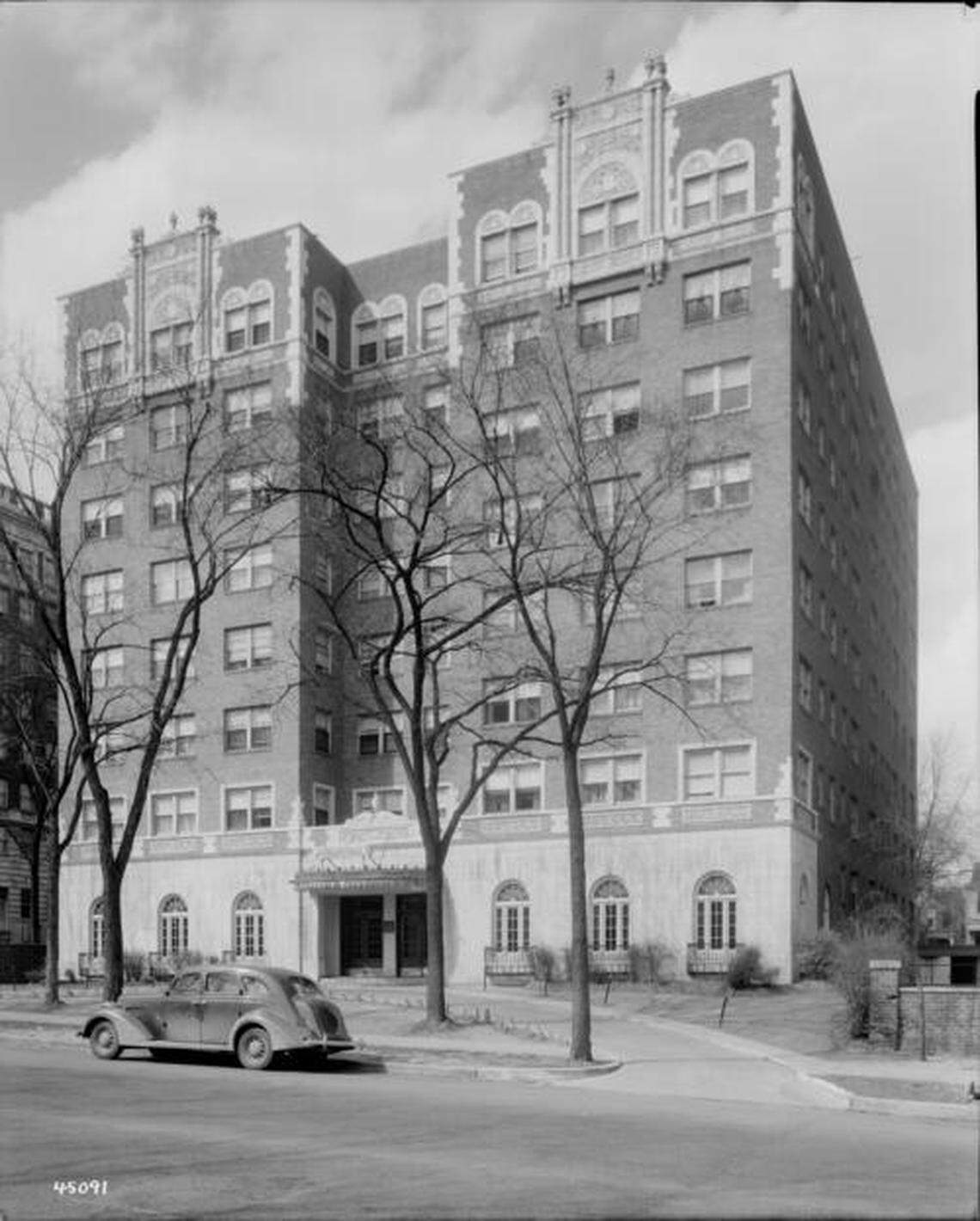 Street level view of the Park Central Hotel located at 300-02 E. Armour Boulevard. The main entrance to the building is in view. A car parked on Armour Boulevard can be seen. The structure was built in 1929 and is part of the Armour/Gillham Historic Apartment-Hotel District