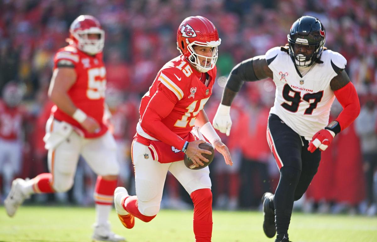 Kansas City Chiefs quarterback Patrick Mahomes (15) runs in for a touchdown in the first quarter on Saturday Dec. 21, 2024, at GEHA Field at Arrowhead Stadium.