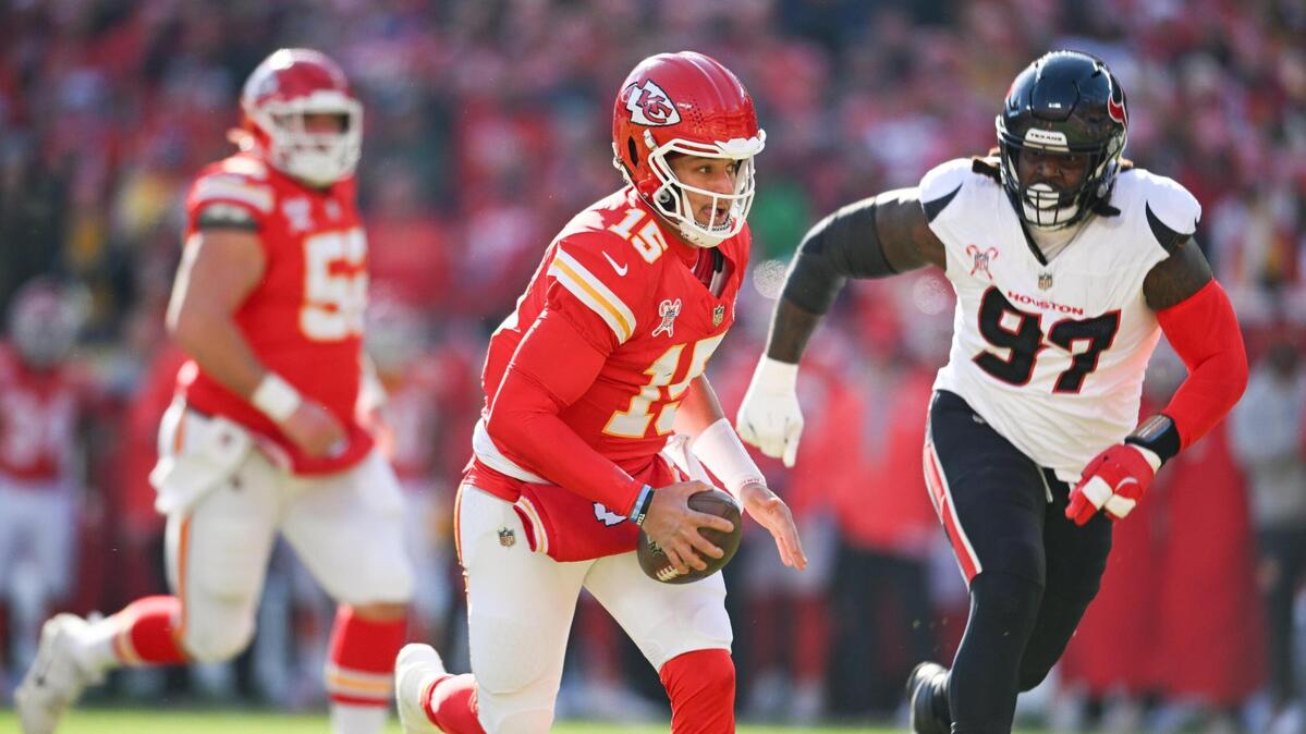 Kansas City Chiefs quarterback Patrick Mahomes (15) runs in for a touchdown in the first quarter on Saturday Dec. 21, 2024, at GEHA Field at Arrowhead Stadium.